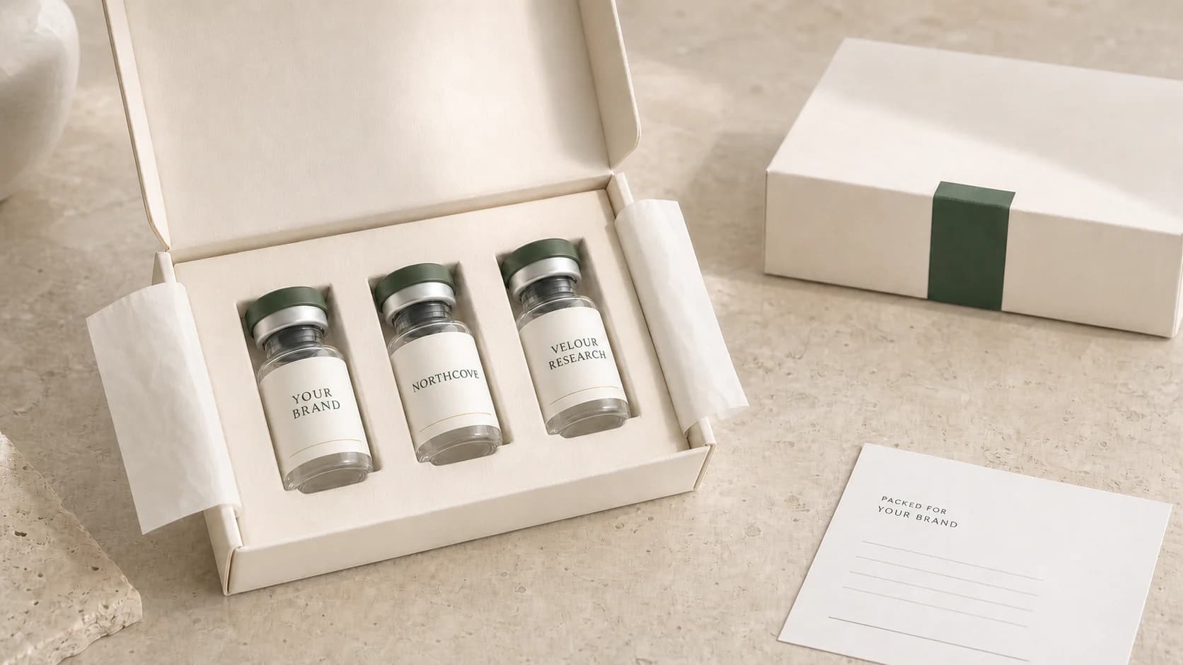 Blind white-label fulfillment kit with three green-cap research vials in an unbranded cream mailer